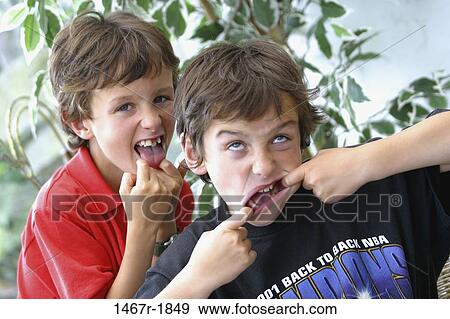 Portrait of two boys making faces View Large Photo Image Stock Photo - Portrait of two boys making faces. Fotosearch