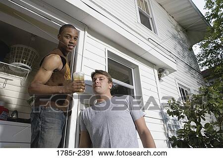 Stock Image - Portrait of two young men. Fotosearch