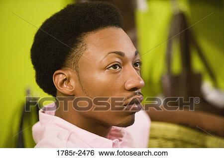 Profile of a young man View Large Photo Image Stock Photograph - Profile of a young man. Fotosearch