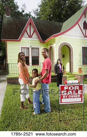 Real estate broker showing house to buyers View Large Photo Image Stock Image - Real estate broker showing house to buyers. Fotosearch
