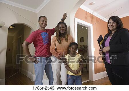 Real estate broker showing house to buyers View Large Photo Image Stock Image - Real estate broker showing house to buyers. Fotosearch