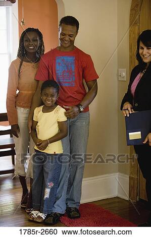 Real estate broker showing house to buyers View Large Photo Image Stock Image - Real estate broker showing house to buyers. Fotosearch