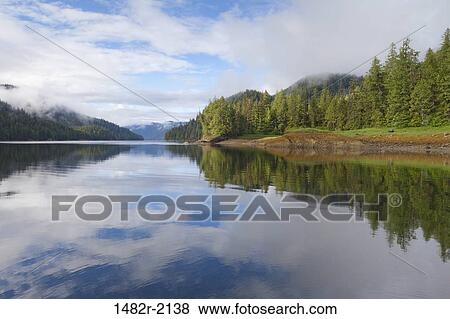 Reflection of clouds in water, Bailey Bay Hot Springs, Ketchikan, Alaska, USA View Large Photo Image Stock Photo - Reflection of clouds in water, Bailey Bay Hot Springs, Ketchikan, Alaska, USA. Fotosearch