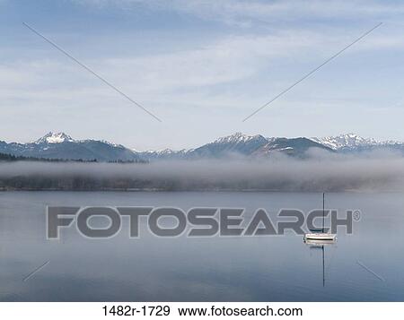 Reflection of mountains in water, Seabeck Bay, Hood Canal, Seabeck, Washington State, USA View Large Photo Image Stock Photo - Reflection of mountains in water, Seabeck Bay, Hood Canal, Seabeck, Washington State, USA. Fotosearch