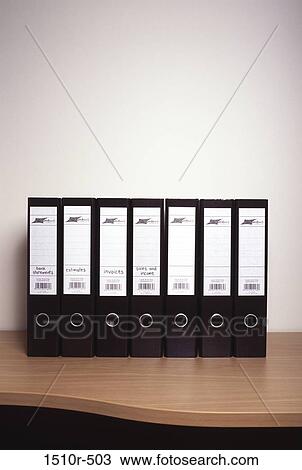 Ring binders on a desk in an office View Large Photo Image Stock Image - Ring binders on a desk in an office. Fotosearch