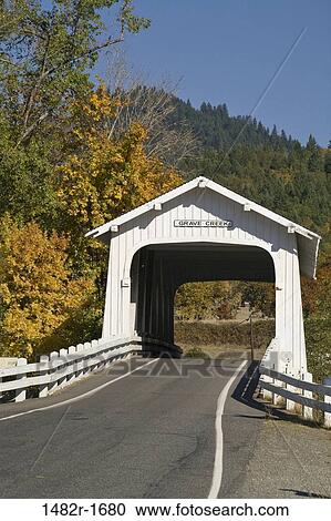 Road passing through a covered bridge, Grave Creek Covered Bridge, Josephine County, Oregon, USA View Large Photo Image Stock Image - Road passing through a covered bridge, Grave Creek Covered Bridge, Josephine County, Oregon, USA. Fotosearch
