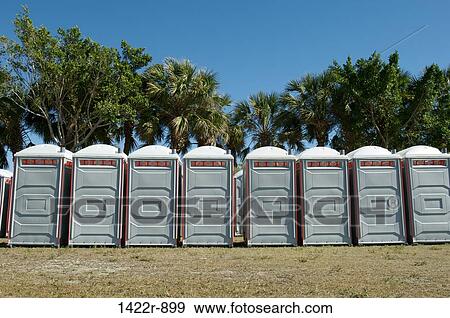 Row of portable toilets outdoors View Large Photo Image Stock Photo - Row of portable toilets outdoors. Fotosearch
