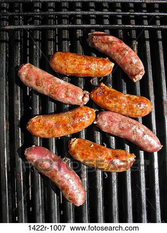 Sausages on an outdoor grill View Large Photo Image Stock Photo - Sausages on an outdoor grill. Fotosearch