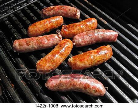 Sausages on an outdoor grill View Large Photo Image Stock Photo - Sausages on an outdoor grill. Fotosearch
