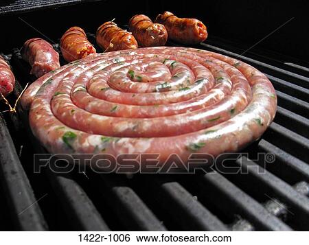 Sausages on an outdoor grill View Large Photo Image Stock Photograph - Sausages on an outdoor grill. Fotosearch