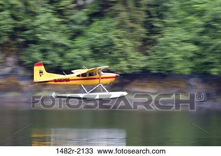 Seaplane taking off on the ocean, Misty Fiords National Monument, Alaska, USA View Large Photo Image Stock Image - Seaplane taking off on the ocean, Misty Fiords National Monument, Alaska, USA. Fotosearch