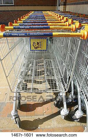 Shopping carts in a row View Large Photo Image Stock Image - Shopping carts in a row. Fotosearch