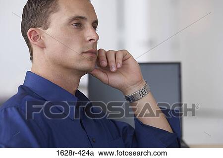 Side profile of a businessman sitting in an office View Large Photo Image Stock Image - Side profile of a businessman sitting in an office. Fotosearch