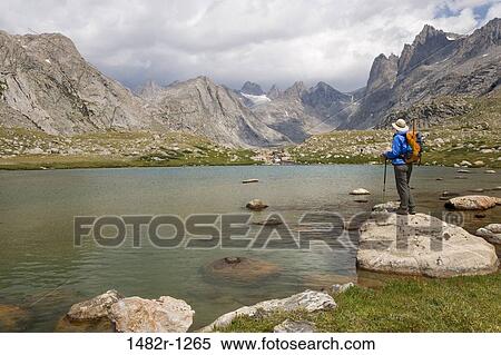 Side profile of a hiker standing at the lakeside, Titcomb Basin, Bridger-Teton National Forest, Wyoming, USA View Large Photo Image Stock Photography - Side profile of a hiker standing at the lakeside, Titcomb Basin, Bridger-Teton National Forest, Wyoming, USA. Fotosearch