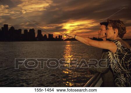 Picture - Side profile of a mid adult couple. Fotosearch