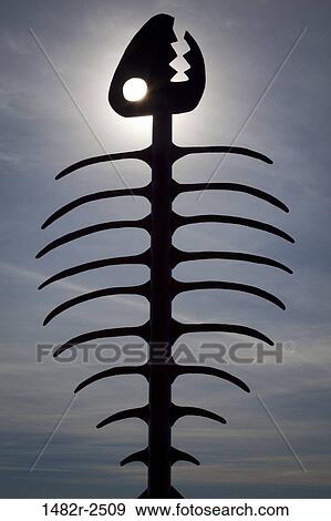 Stock Photo - Silhouette of a fishbone sculpture, Embarcadero Marina Park, San Diego, California, USA. Fotosearch