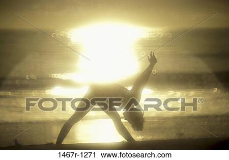 Silhouette of a woman exercising on the beach View Large Photo Image Stock Image - Silhouette of a woman exercising on the beach. Fotosearch