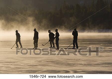 Silhouette of ice hockey players playing ice hockey View Large Photo Image Picture - Silhouette of ice hockey players playing ice hockey. Fotosearch