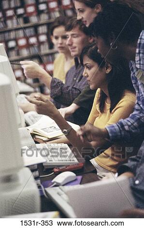 Students sitting in front of computer monitors View Large Photo Image Stock Image - Students sitting in front of computer monitors. Fotosearch