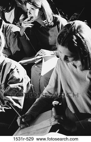 Students writing during an examination View Large Photo Image Stock Photo - Students writing during an examination. Fotosearch