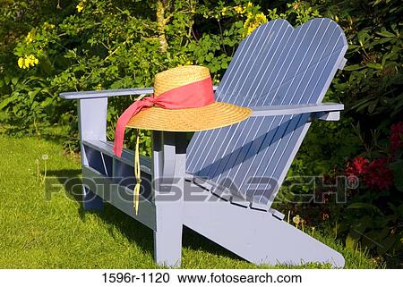 Sun hat on the armrest of an adirondack chair in a garden, Schreiner's Iris Gardens, Keizer, Oregon, USA View Large Photo Image Stock Image - Sun hat on the armrest of an adirondack chair in a garden, Schreiner's Iris Gardens, Keizer, Oregon, USA. Fotosearch
