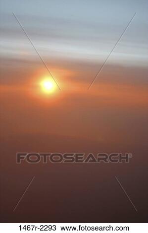 Stock Image - Sunset over a landscape. Fotosearch