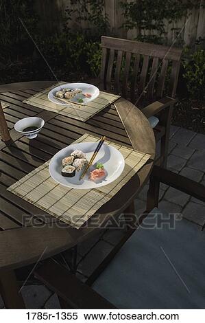 Sushi served with chopsticks View Large Photo Image Stock Photography - Sushi served with chopsticks. Fotosearch