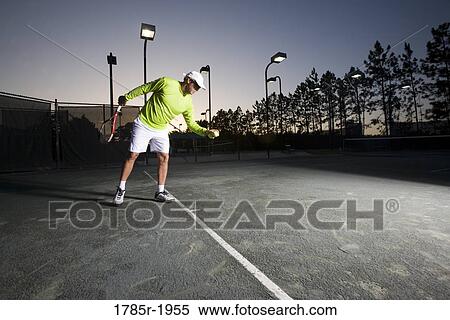 Tennis player getting ready to serve View Large Photo Image Stock Photography - Tennis player getting ready to serve. Fotosearch