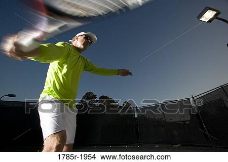 Tennis player hitting a backhand View Large Photo Image Picture - Tennis player hitting a backhand. Fotosearch