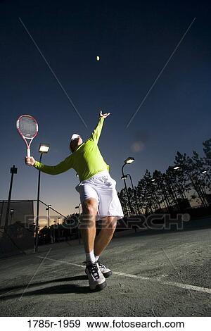 Tennis player serving View Large Photo Image Stock Photo - Tennis player serving. Fotosearch