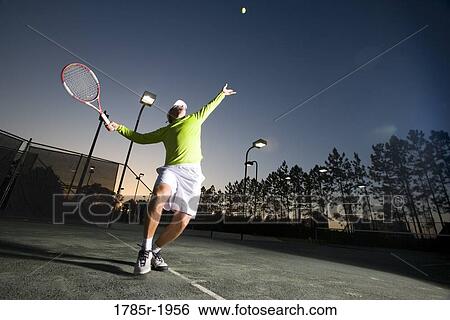 Tennis player serving View Large Photo Image Stock Photograph - Tennis player serving. Fotosearch