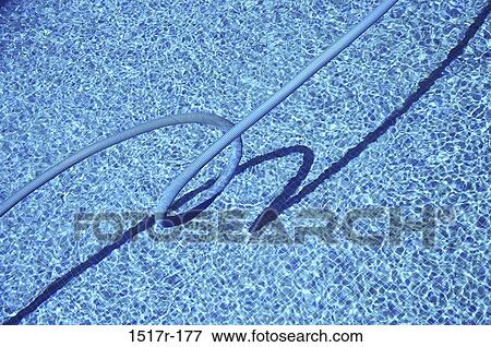Stock Photo - Tube in a swimming pool. Fotosearch