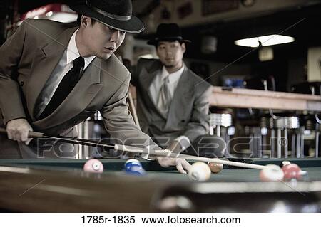 Two Asian men shooting pool View Large Photo Image Stock Photography - Two Asian men shooting pool. Fotosearch