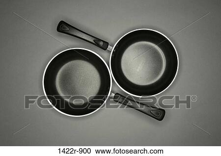 Two kitchen non stick frying pans View Large Photo Image Stock Image - Two kitchen non stick frying pans. Fotosearch