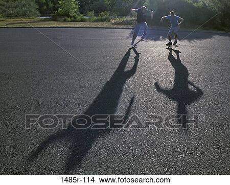 Two teenage boys skateboarding View Large Photo Image Picture - Two teenage boys skateboarding. Fotosearch