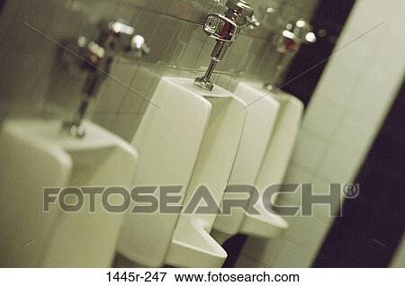 Stock Photo - Urinals in a public bathroom. Fotosearch
