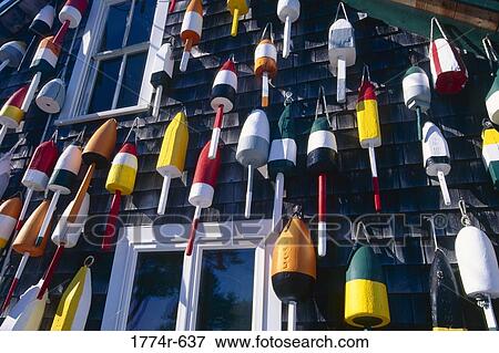 USA, Maine, Colorful lobster buoys hanging on wall of house View Large Photo Image Stock Photo - USA, Maine, Colorful lobster buoys hanging on wall of house. Fotosearch