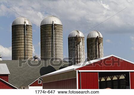 Stock Photo - USA, New Jersey, Hunterdon County, Grain storage towers at farm. Fotosearch