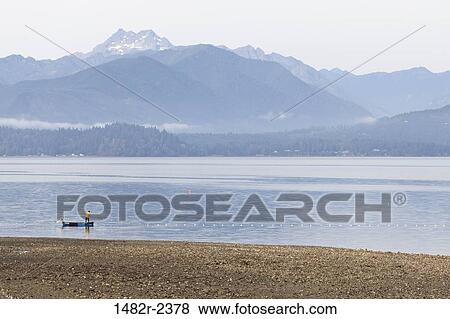 USA, Washington, Seabeck, Fisherman in boat on Hood Canal View Large Photo Image Stock Photo - USA, Washington, Seabeck, Fisherman in boat on Hood Canal. Fotosearch