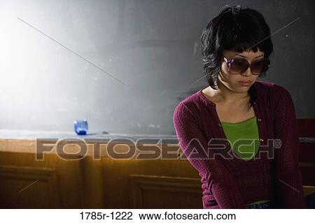 View of a contemplative young Asian woman View Large Photo Image Stock Image - View of a contemplative young Asian woman. Fotosearch