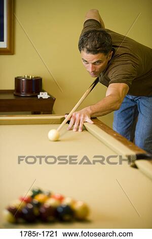 View of a man shooting pool View Large Photo Image Stock Image - View of a man shooting pool. Fotosearch