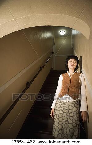 View of a young Asian woman at bottom of staircase View Large Photo Image Stock Image - View of a young Asian woman at bottom of staircase. Fotosearch