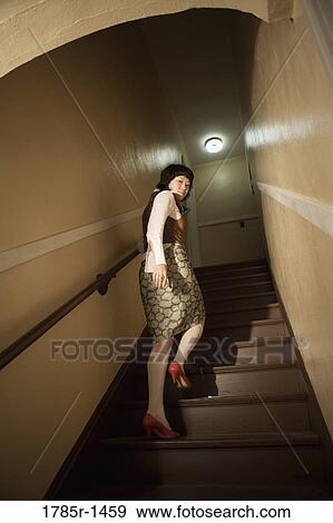 View of a young Asian woman at bottom of staircase View Large Photo Image Stock Photo - View of a young Asian woman at bottom of staircase. Fotosearch