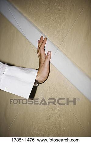View of woman's hands touching the wall View Large Photo Image Stock Photograph - View of woman's hands touching the wall. Fotosearch