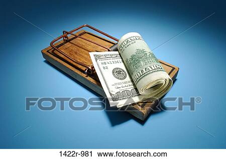 Stock Image - Wooden mousetrap with roll of US currency as bait. Fotosearch