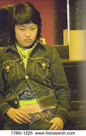 Young Asian woman in washroom View Large Photo Image Stock Photography - Young Asian woman in washroom. Fotosearch