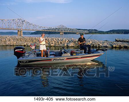 Young couple fishing on a boat View Large Photo Image Stock Photography - Young couple fishing on a boat. Fotosearch