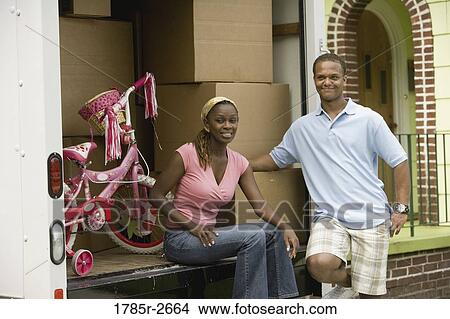 Young couple near a moving truck View Large Photo Image Picture - Young couple near a moving truck. Fotosearch