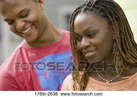 Young couple smiling View Large Photo Image Stock Photo - Young couple smiling. Fotosearch