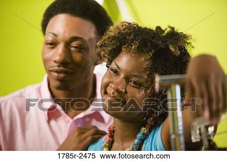 Stock Photography - Young couple smiling. Fotosearch